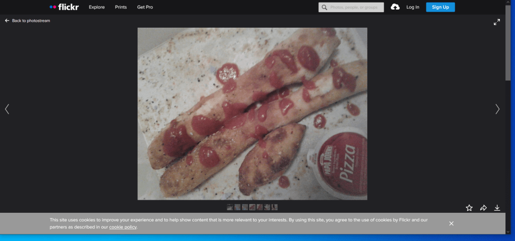 Breadsticks covered with pizza sauce